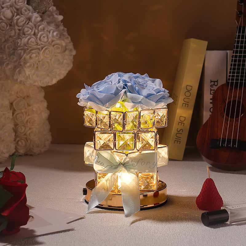 Lámpara de mesa con rosas de cristal y luces navideñas