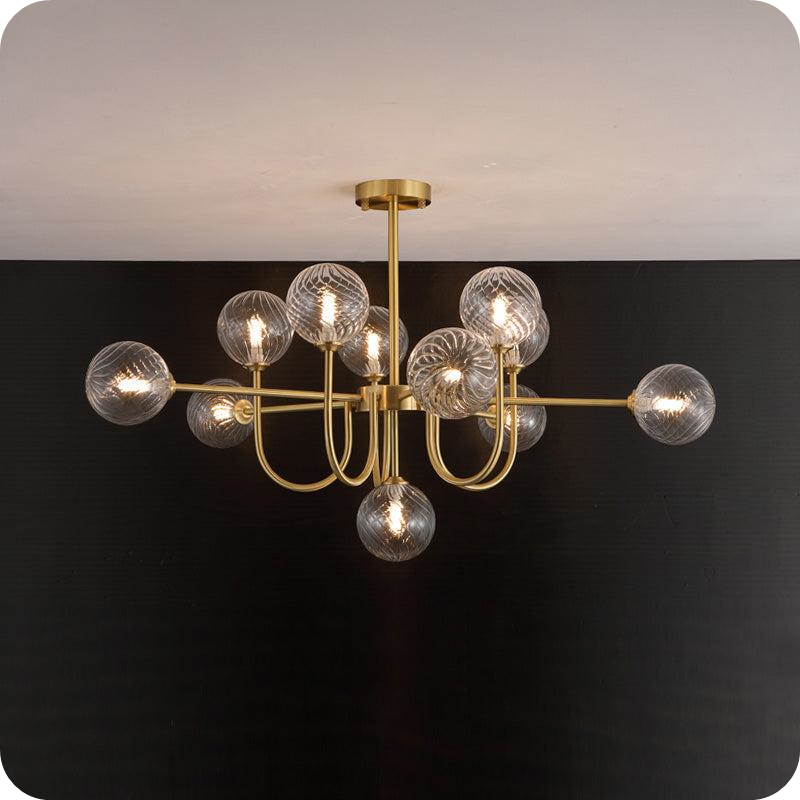 Glass Globe Brass Arm Chandelier